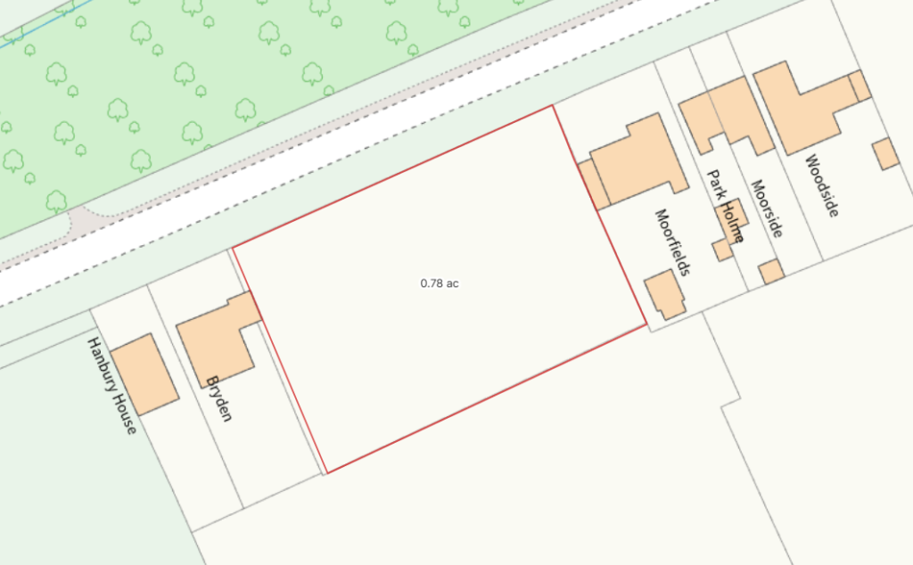 A plan of the site showing the development plot, access road to the front and properties to either side.