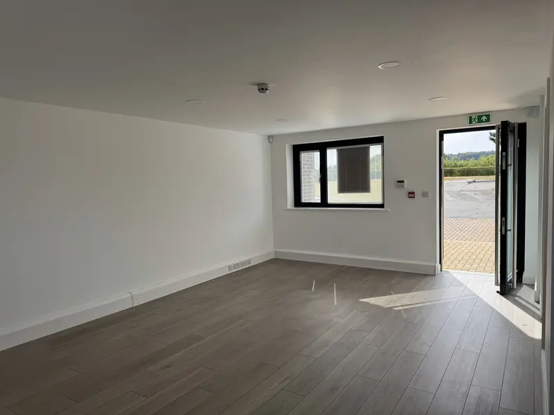 The interior of Fields Edge Unit 23 looking through the open door to the car park.